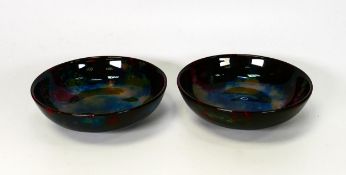 Two unmarked presumed Royal Doulton Flambe with experimental glaze. Diameter 12.5cm
