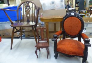 A collection of furniture items including wheelback dining chair, childs armchair, inlaid musical