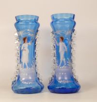 A Pair of Mary Gregory Style Blue Glass Vases with enamel decoration. Height: 28cm