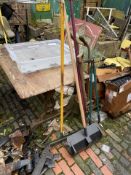 A quantity of mostly wooden handled vintage garden tools and impliments, spades, shoves, forks,