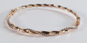 9ct rose gold buckle twisty bracelet set with white stones, 4.3g.