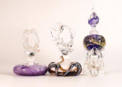 Three European Art Glass scent bottles. Signatures to the two purple bottles. Height of tallest 23cm