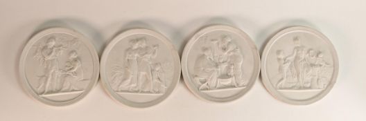 Set of four Royal Copenhagen bisque porcelain roundels with classical decoration, each 13.6cm