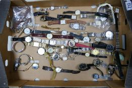 A collection of mens & lady's wrist watches , some spares but mostly unchecked