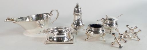 A collection of silver plated items comprising cruet, tea strainer, tea spoons, knife holders and