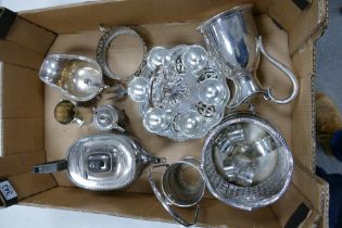 A collection of silver plated items to include Egg Cup Stand, Bottle Coasters, Sauce Boat, Teapot
