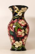Moorcroft RHS Tatton Park vase decored with pink flowers and bumble bees. Designed by Rachel