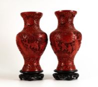 Pair of 19th century Chinese Cinnabar lacquer vases together with stands, 28cm and 24cm high
