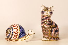 Royal Crown Derby paperweights to include seated cat and a Snail. Both gold stoppers (2)