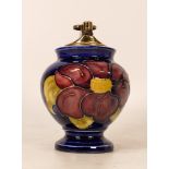Moorcroft Clematis on blue lighter . Height 12cm. Boxed