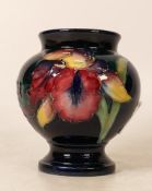 Moorcroft Orchid foot vase. Height 8.5cm. Boxed Damage to top rim which has been reglued with some