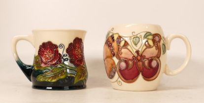 Moorcroft Butterflies mug together with floral mug dated 2000. (2)