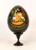 Russian Lacquered Egg on Stand with handpainted scene of four working women. Height incl stand: 18cm