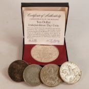 Group of silver coins including $10 1974 sterling coin, 2 x UK 1935 .500 crowns, large Islamic