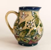 Moorcroft Fruit Garden jug. Height 14.5cm . Silver line seconds quality. Boxed