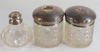 Three silver topped glass scent bottles. (3)