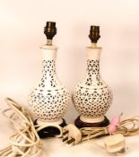 A pair of Chinese reticulated Blanc de Chine Vases converted in to lamps. Height 30cm including