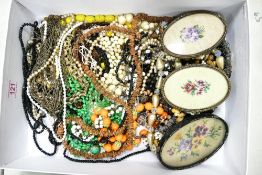 A Collection of Costume Jewellery mostly beaded necklaces including three framed floral embroideries
