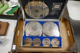 A boxed vintage set of Cavalier silver plated coaster place mats