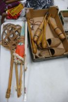 A mixed collection of items to include vintage wooden clogs, exercise bats, parasols, Wicker