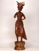 Burmese Craved Wood Female Dancer on stylised leaf base base. Height: 73cm