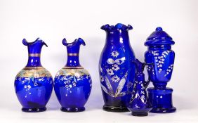 Five Victorian Cobalt Blue Glass items to include Vases, Jug and Pedestal Urn. Damage to gilt