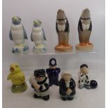 A collection of Wade figures to include Yellow chick with stopper, 2 Penguins, Policeman, Judge,