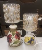 Two Moorcroft Hibiscus on cream ground table lamps with vintage glass shades, height to top of