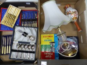 A mixed collection of items to include cased cutlery sets, damaged Oriental vase, glass table lamp