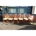 A Set of Six Wheelback Windsor Chairs on Turned Supports with H-Shaped Stretcher. Height: 90cm