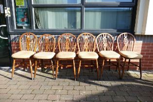 A Set of Six Wheelback Windsor Chairs on Turned Supports with H-Shaped Stretcher. Height: 90cm
