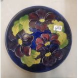 Moorcroft Clematis pattern on cobalt blue ground charger 31cm in diameter.