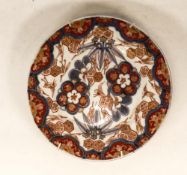19th Century Japanese Imari Plate decorated in Iron Red, Blue and Gilt Patterns in the form of