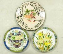 Three Large Wall Plates, One European Sgraffito Charger with Fruit Still life and two GoldImari