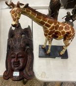 Large Wooden African hand carved mask together with Tall hand carved Wooden African Giraffe on