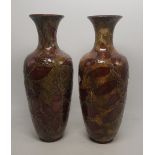 Pair of early 20th century Doulton Lambeth vases with leaf decoration, height 27cm, restoration to
