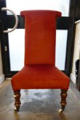 19th Century Red Velvet Upholstered Prie Dieu or PRayer Chair of Ceramic Castors. Height: 102cm