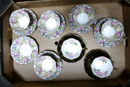 A collection of Royal Albert tea cup and saucers, decorated with roses & lustre. (15)