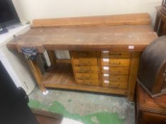 Large mid century oak work bench, with bench vice and integral drawers.