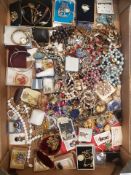 A large collection of vintage costume jewellery to include beads, broches, necklaces, watches,