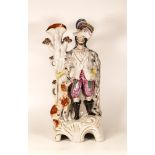 A Well Painted Mid-Victorian Staffordshire Figure depicting a Hunter with Dog. In Overglaze