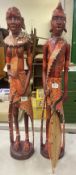 Two large African carved statues of warrior and woman decorated in beads and shells