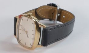 Omega 9ct gold rectangular TV shaped mechanical wristwatch with black leather strap. In ticking