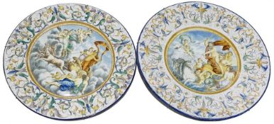 A large pair of European Majolica chargers, polychrome decoration of mythological & religious