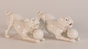 Two Bernard Moore Blanc de Chine models of Pugs playing with Ball. One with moulded tongue, one