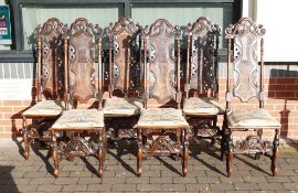 Set of 6 carved dark Oak high backed dining chairs, Bergère panels with needlepoint seats, h.136cm x