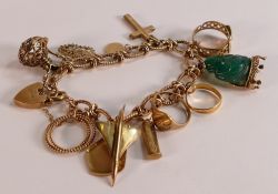 Quality 9ct gold charm bracelet with 13 charms including Concorde, 22ct wedding ring etc. 55.5g.