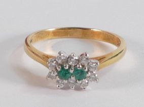 18ct emerald & diamond ring, two small emeralds surrounded by 10 small diamonds, ring size P, 3.5g.