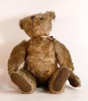 In the style of Steiff, early 20th century stuffed Teddy bear. Hump to back noted and centre seam to