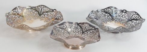 Trio of matching pierced silver dishes, a larger pair and a single smaller one. Larger pair (17cm